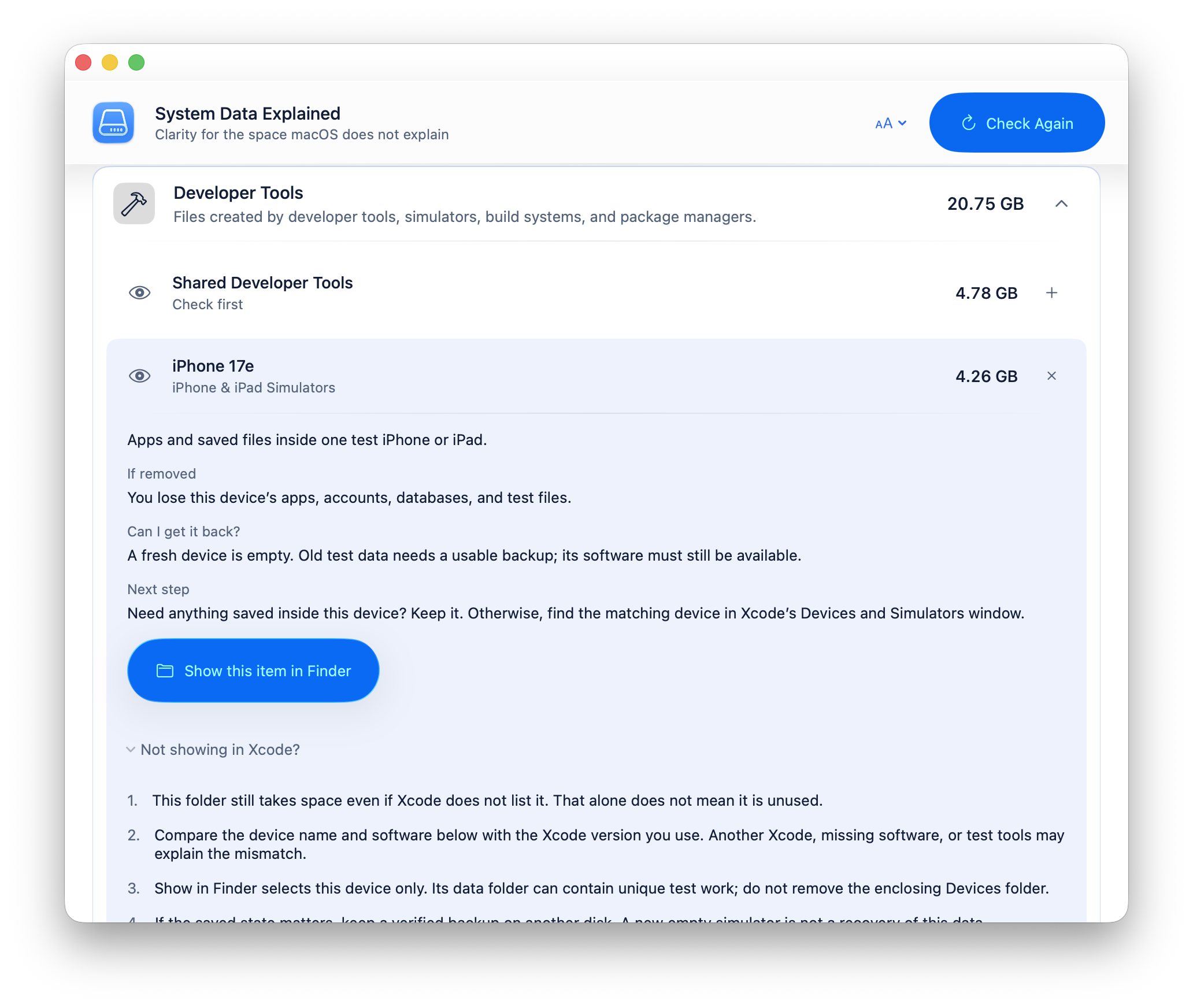System Data Explained showing removal consequences, recovery guidance, and a Finder action for an iPhone simulator